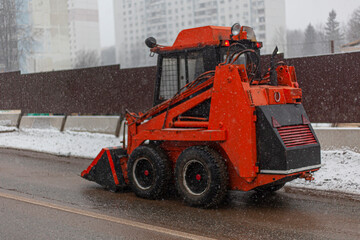 Harvesting equipment. Special transport for cleaning in the city. Orange truck.
