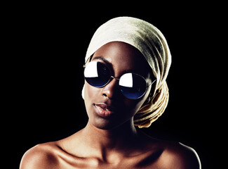 Black woman, portrait and sunglasses with scarf for fashion or style on a dark studio background....