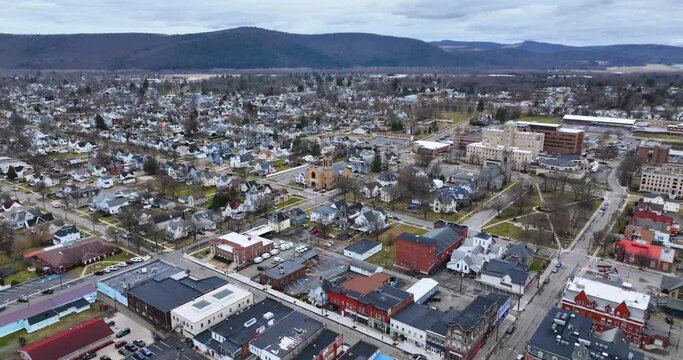 Sayre, PA, USA - 03-03-2024 - Cloudy winter aerial video of the downtown area in the City of Sayre, PA. 