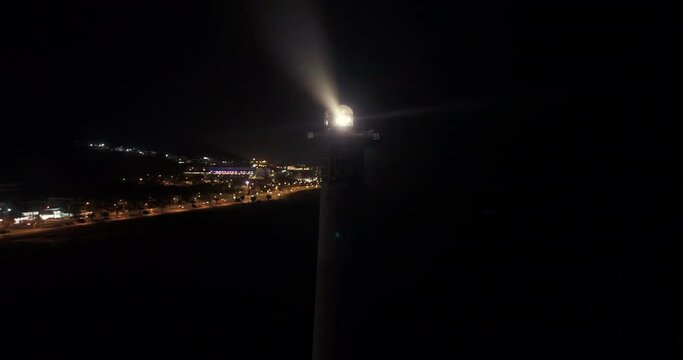 Jandia lighthouse at night aerial drone shot standing still