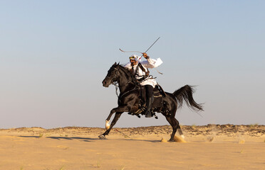 Horseback archery in a desert of Saudi Arabia