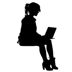 Office worker. Businesswoman is sitting at the desk and working on the laptop.    Silhouette  isolated on white.