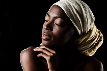 Beauty, profile and black woman with head wrap, natural makeup or creative aesthetic in studio...