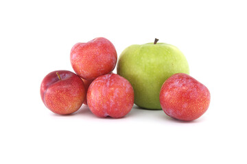 Red plums and green apple isolated on white background