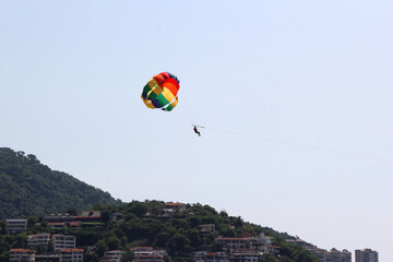 Parasailing, Parascending or Parakiting is an aquatic activity where a person attached to a...