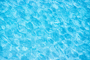 Background Of Blue Water In Swimming Pool With Reflections And Caustics