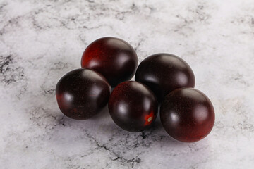 Raw ripe black kumato tomato
