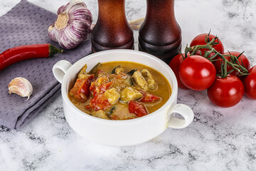Traditional yellow Thai curry with chicken