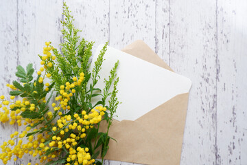 International women's day concept beautiful mimosa flower composition with blank greeting card. beautiful floral background for Women's day.