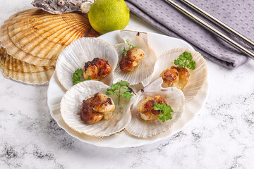 Grilled scallops shell with butter
