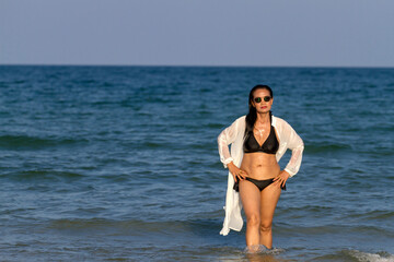 Fototapeta na wymiar Woman body pretty with black bikini on beach