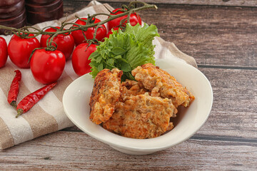Fried salmonn cutlet in the bowl
