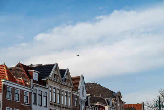 Photo of the clouds with a typical Dutch houses.