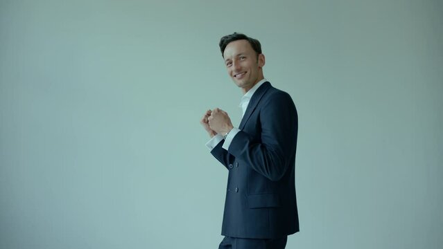 Handsome Caucasian Man In Suit Happy Motivated Smiling and Looking Aside, Studio Shot
