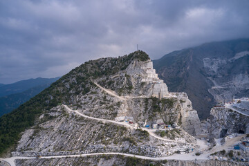 Aerial panorama of marble quarries Carrara. Carrara mountains. Quarry - the place where...