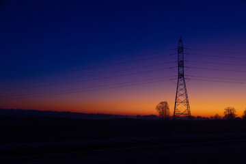 Fototapeta premium A beautiful morning scenery of an industrial construction against the sky. Early winter scenery of Northern Europe.