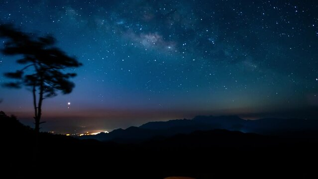 nature traveling with timelapse and zoom orange camping tent on mountain with milky way background