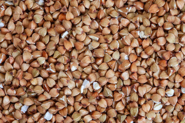 De hulled buckwheat close-up, full frame background or texture