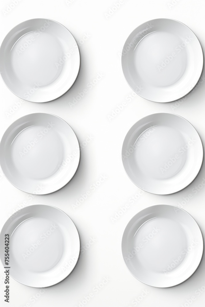 Poster a set of four white plates on a white surface. ideal for kitchen and dining concepts