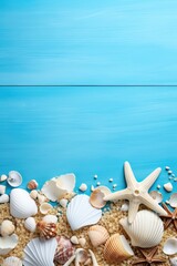 Obraz na płótnie Canvas Seashells and starfish on a blue wooden background. Ideal for beach-themed designs