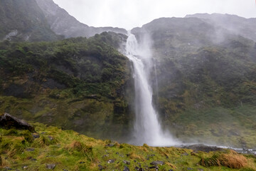 Spectacular views on Lush Native Forest and Waterfalls, Rainy Day Boat Cruise adventure in Milford Sound, New Zealand