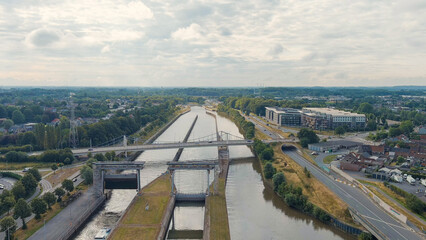 Ghent, Belgium. Ringvaart in Ghent - water channel. Sluis Merebeke - landmark, gateway to the...