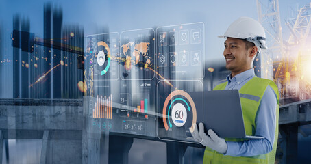 Double exposure of engineering holding laptop with Technology construction interface icon graphic showing automation system, Construction technology and control future industrial concept.