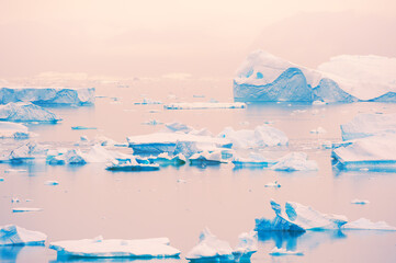 Icebergs at sunset in Greenland. Atlantic ocean, Ilulissat icefjord, Greenland.