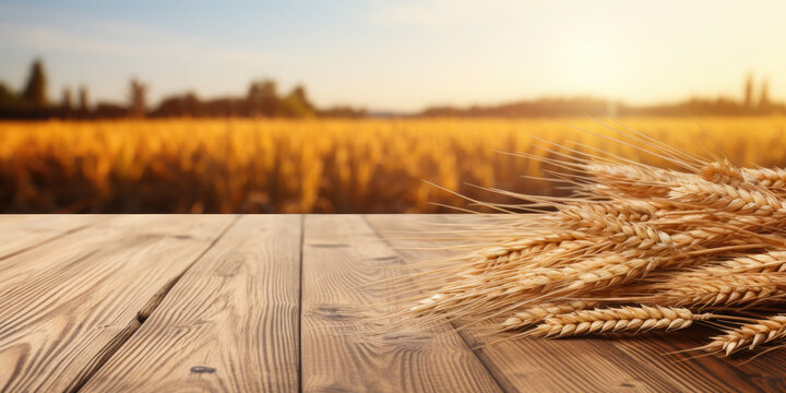 Empty wooden table for product demonstration and presentation on the background of a wheat field. Banner
