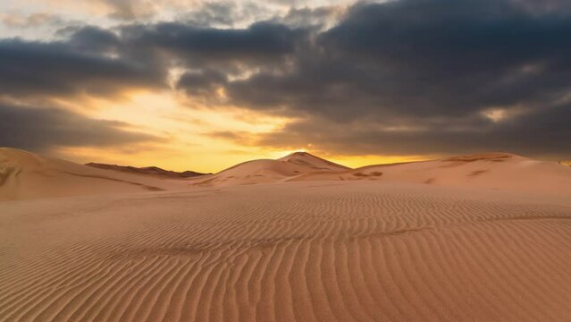 Timelapse of sunset over the sand dunes in the desert. Sahara desert