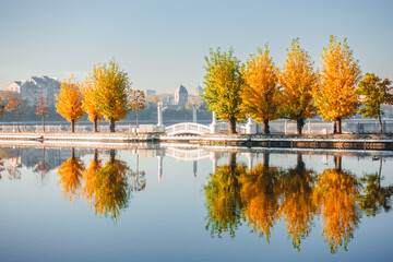 Fantastic morning promenade with autumn trees on the lake. Ternopil, Ukraine, Europe.
