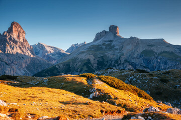 Great rocky massif in the Italian Alps on a sunny day. National Park Tre Cime di Lavaredo, Dolomites, Italy, South Tyrol. - obrazy, fototapety, plakaty
