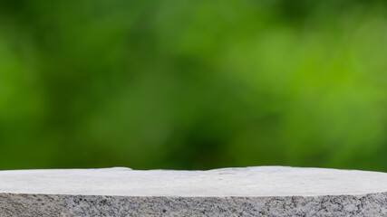 Podium with green forest blur background