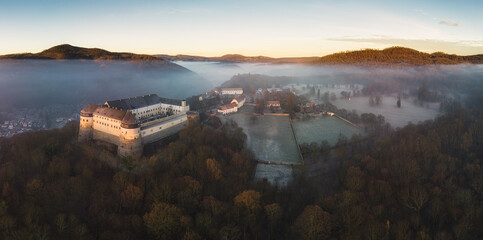Slovakia - Cerveny kamen castle at sunrise over mist. - 755435481