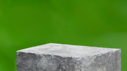 Podium with green forest blur background
