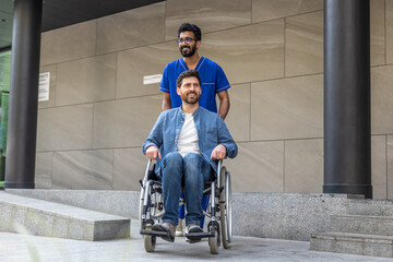 Fototapeta na wymiar Male nurse in a blue doctors overall with a wheelchair