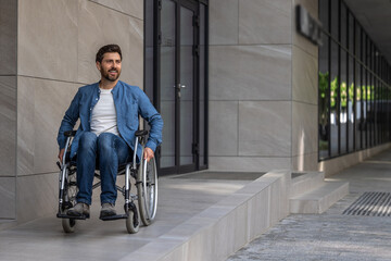 Young bearded man riding a wheelchair in a hospital yard