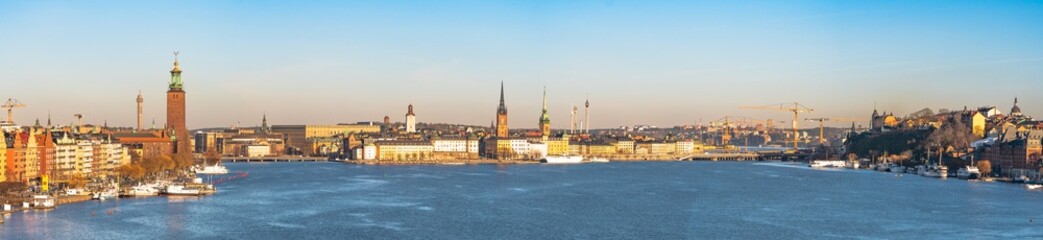 Panorama of Stockholm old town, kungsholmen and S&ouml;dermalm district with the Lake Mal&auml;ren in front view. Clear winter sky, colorful buildings, churches and cathedrals and the Stockholm town hall.