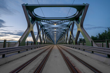 The old bridge over the Danube river in the evening. Bratislava, Slovakia. Perspective view.