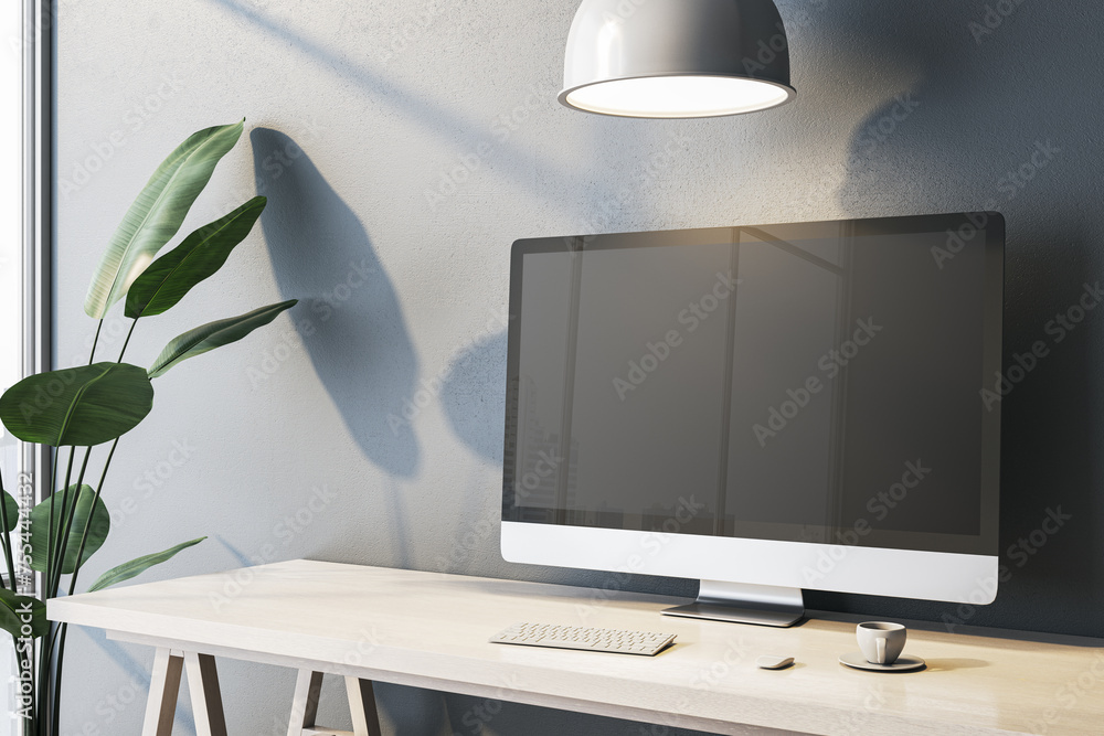 Poster contemporary home office interior with empty computer monitor on designer desktop. concrete wall bac