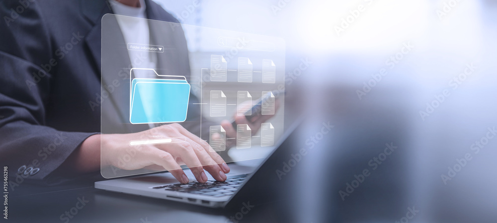 Poster Document management system concept, Businessman using a laptop computer and smartphone at the office after being set up by an IT specialist. Software for corporate file archiving