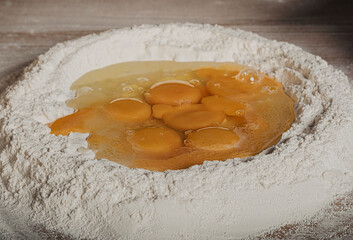 flour and eggs on wood
