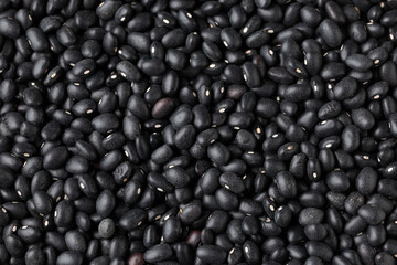 Raw close up black turtle beans background.