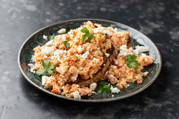 Strapatsada, eggs scrambled with bread, tomatoes and feta cheese. Greek breakfast