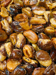 snacks fried broad beans or fava beans texture background.