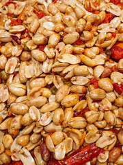 snack fried spicy peanuts background.
