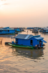 Village on the water of Tonle Sap lake in Cambodia. Beautiful lighting, sunset.