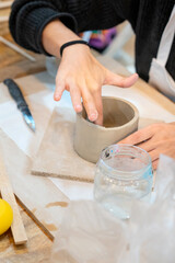 Obraz na płótnie Canvas Pottery classes. Women working in the workshop.