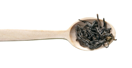 Green tea in wooden spoon isolated on transparent background. herbal dried leaves flat lay