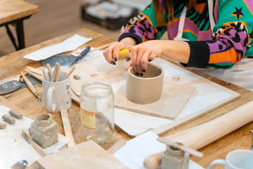 Pottery classes. Women working in the workshop.